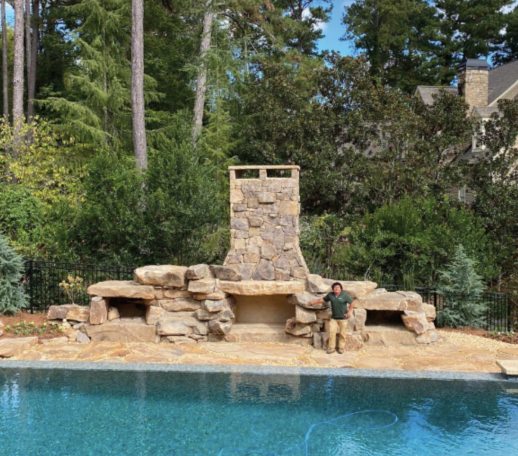 Large Outdoor Fireplace by Pool in Marietta