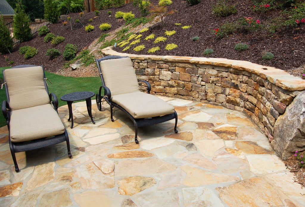 Landscape design Stone patio with retaining wall